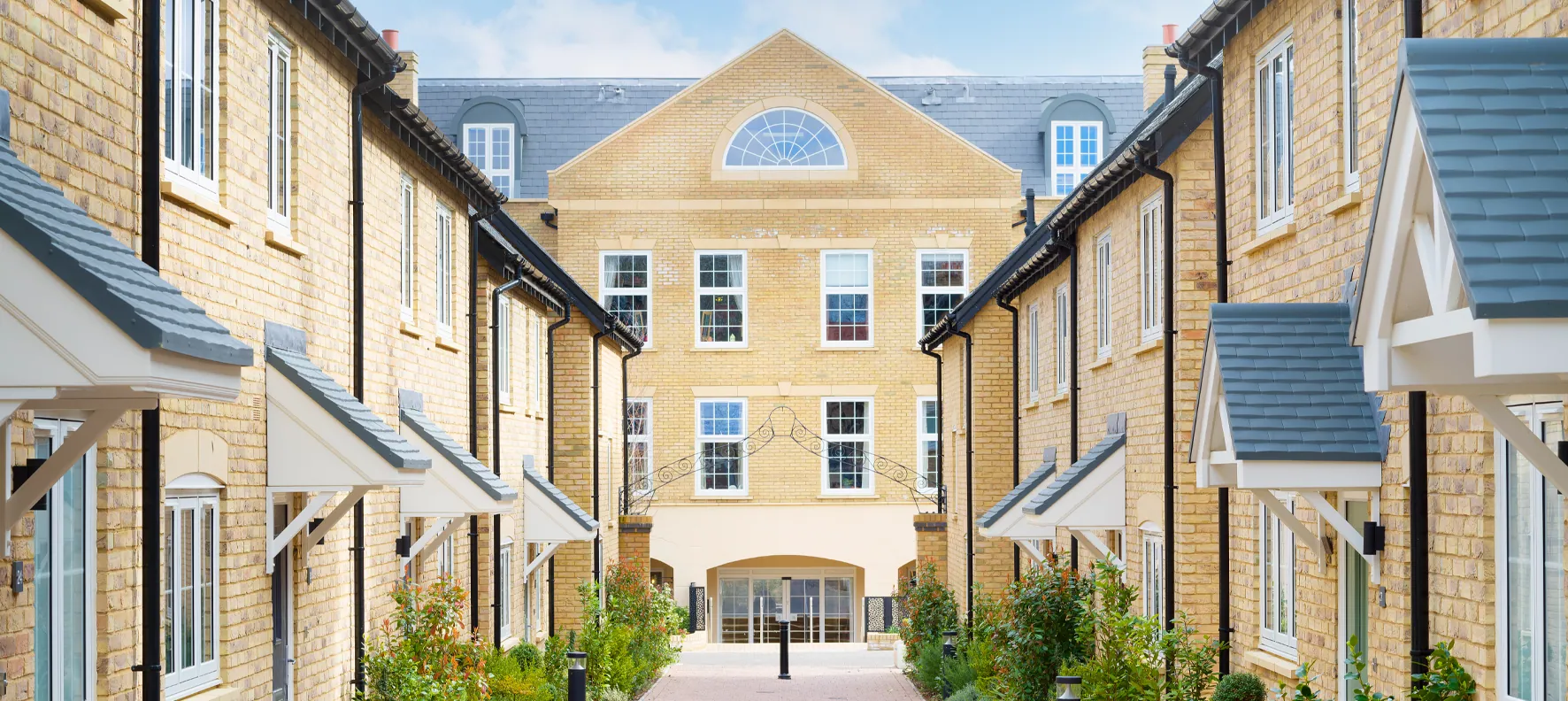 New homes around a landscaped courtyard at an AHC community