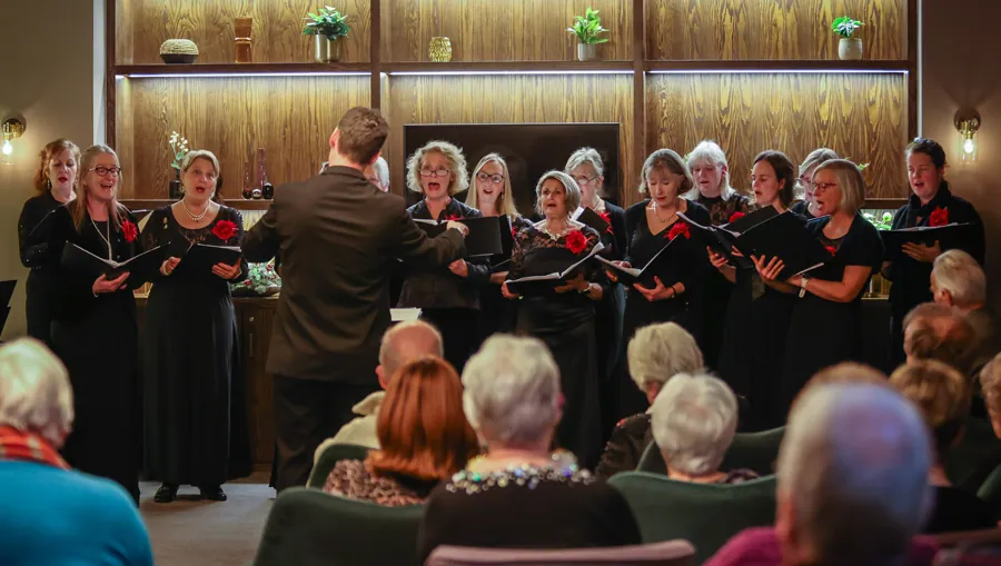 A choir performing for residents