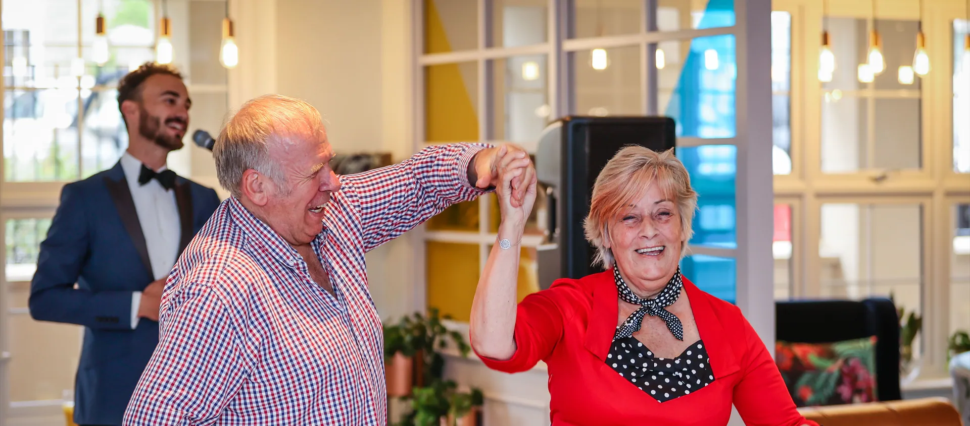 A couple dancing at a community celebration