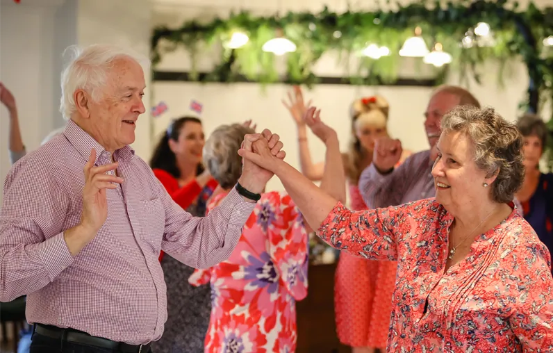Couples dancing at a community party