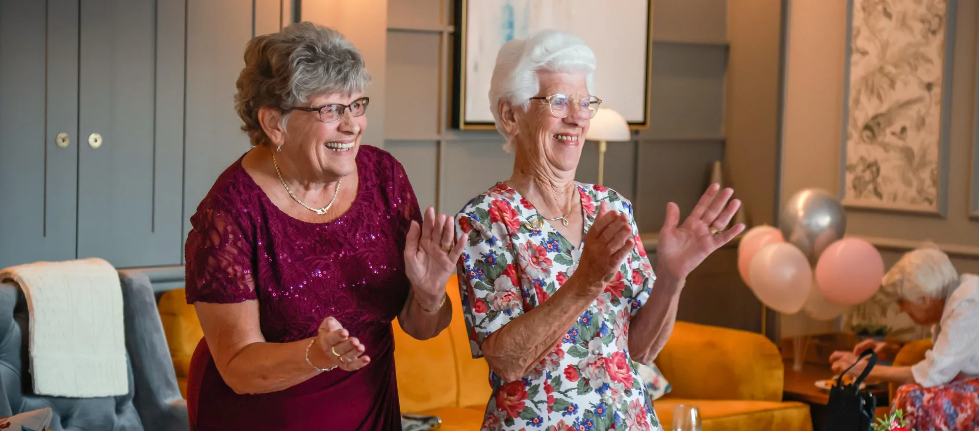 Residents applauding at a community event